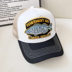 Retro trucker hat in white, beige, and black mesh with vintage fishermen embroidery
