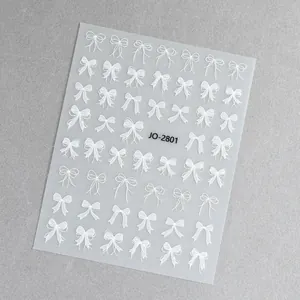 Dettaglio adesivi per unghie con fiocchi bianchi, motivi a pois e strisce, modello JO-2801