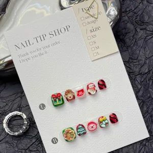 Macro shot of 10pcs 3D Christmas press-on nails with Santa Claus and Reindeer designs