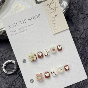 Cute brown cartoon bear press-on nails set for girls with heart pearls and 10pc display