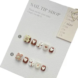 Cute cartoon press-on nails for girls featuring brown flocking bears and heart pearls