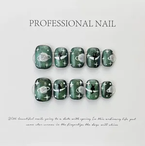 Detail of handmade galaxy press-on nails with silver planets and black cat on moon