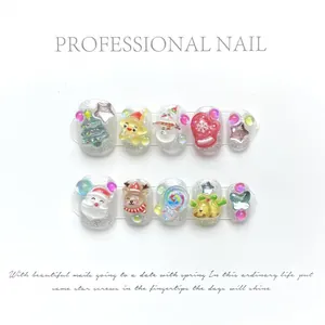 Handmade 3D Christmas press-on nails featuring Santa, reindeer and glitter silver finish