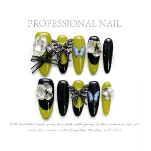 Handmade almond press-on nails with luxury crystal butterflies and green-black French design