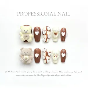 Brown and cream press-on nails with 3D flocking bears and heart pearl accents