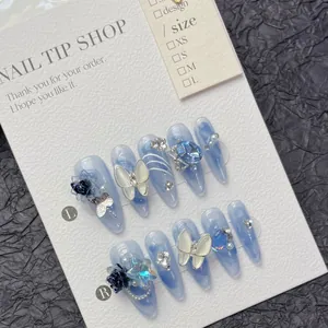 Blue gradient stiletto fake nails with 3D butterflies and floral rhinestones decor