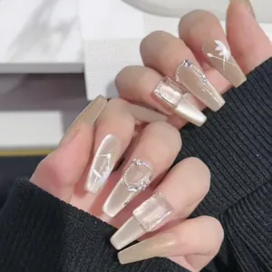 Elegant coffin-shaped press-on nails with cat-eye effect and 3D floral accents