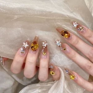 Handmade coffin press-on nails with blush gradient, amber jewels, and pearls