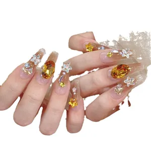 Elegant long ballerina press-on nails with pink blush gradient and yellow rhinestones