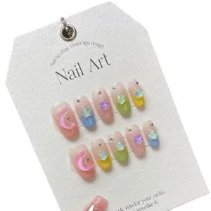 Star and moon macaron press-on nails with 3D star charms and shiny rhinestones