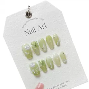Handmade green gradient press-on nails with 3D rose and butterfly decorations