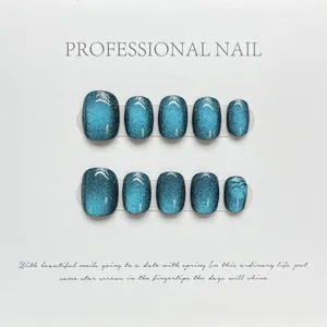 Short blue-green cat-eye press-on nails set with vibrant magnetic rainbow laser effect