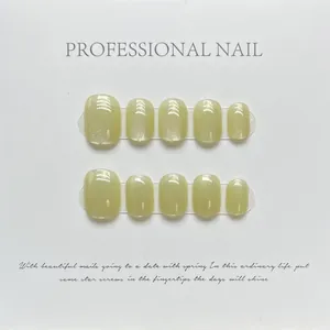 Handmade mustard green short press-on nails with rainbow cat-eye laser shimmer
