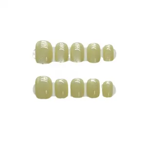 Short square mustard green cat-eye press-on nails with 10-piece rainbow shimmer set