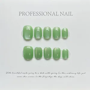 Short square green cat eye press-on nails set with 10 pieces on white background
