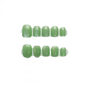 Handmade light green cat eye press-on nails with colorful laser rainbow shimmer texture