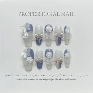 Handmade press-on nails with 3D aurora bows and camellia flowers in blue and white