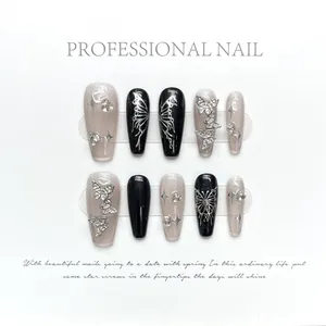 Handmade Y2K black and white coffin press-on nails with liquid butterfly and rhinestones
