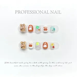 Kids' 3D teddy bear press-on nails with cute orange and white paw patterns for girls