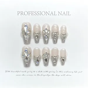 Luxurious handmade press-on nails with pink aurora powder, pearls and large crystals