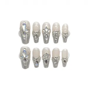 Sparkly Aurora handmade press-on nails with silver rhinestones and flower crystals
