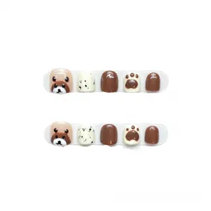 Kids press-on nails set with cute brown bear, paw prints, and speckled patterns