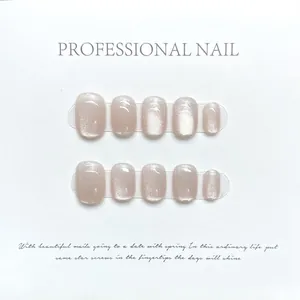 Handmade champagne pink cat-eye press-on nails with glitter finish and square-oval shape