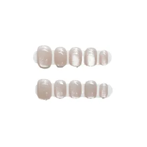 Pink cat-eye handmade press-on nails with sparkling crystal glitter finish and short round shape