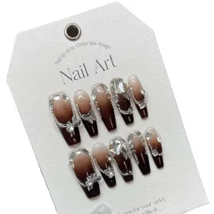 Handmade caramel gradient press-on nails set with large rhinestones and metal charms