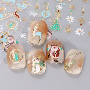 Christmas nail art stickers featuring gold reindeer, snowflakes and Santa Claus patterns