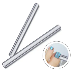Dual-head magnetic nail tool for cat eye polish effects with cylindrical silver rods