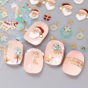 Christmas nail stickers with gold foil Santa, reindeer, and snowflakes on matte nails