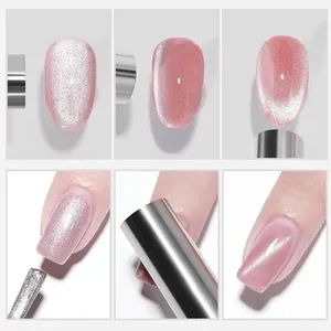 Macro view of double-headed nail magnet creating cat eye effects on pink gel polish