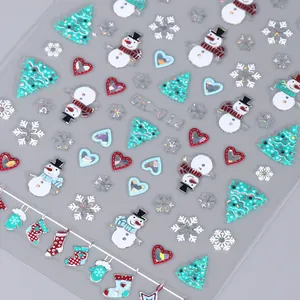 Macro di adesivi per nail art natalizi laser 3D con dettagli di pupazzo di neve e fiocchi