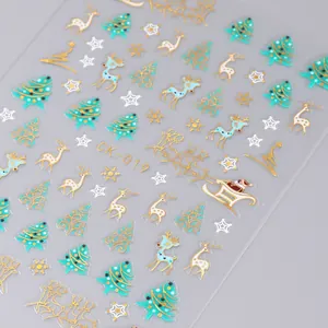 Detail of Christmas nail art sticker with golden reindeer, snowflakes and Santa patterns