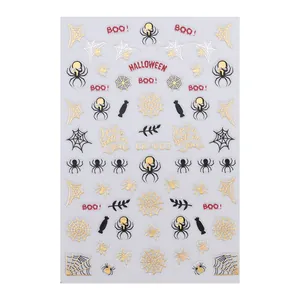 Autocollants d'ongles Halloween avec araignées dorées et lettrage BOO pour nail art