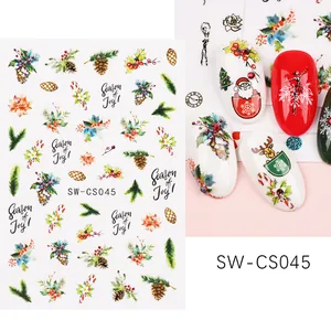 Vista dettagliata di adesivi per unghie natalizi con motivi di Babbo Natale e nail art
