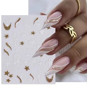 Macro detail of 3D embossed Christmas nail stickers with gold glitter and star patterns