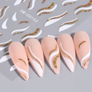 Christmas nail art stickers with gold glitter wave lines and white snow patterns