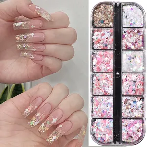 Detailed view of 12-grid nail glitter set with pink hearts and star shapes for nail art
