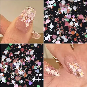 Macro view of iridescent pink nail glitter mixed with star, heart and hexagon shapes