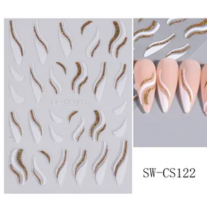 Macro view of white 3D wave patterns and gold glitter lines on Christmas nail stickers
