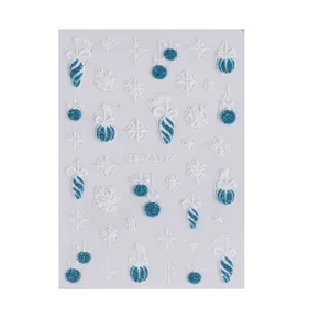 5D Christmas nail stickers with white snowflakes and glitter blue ornaments on white background