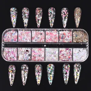 Detail of 12-grid nail art sequins with pink hearts and stars on black background