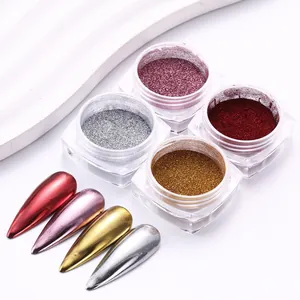 Detail view of chrome nail powder set in silver, gold, rose and red metallic finishes
