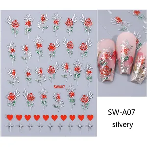 Detail view of 3D nail stickers featuring red roses, hearts, and silver metallic stars