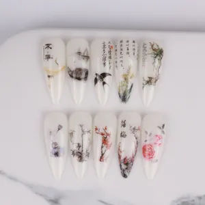 Detail of Stiletto press-on nails featuring Chinese ink painting and crane motifs
