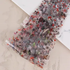 Macro detail of transparent nail foil with traditional Chinese ink bamboo and plum blossoms
