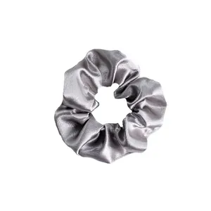Elegant silver grey satin scrunchie with silky texture and soft metallic luster