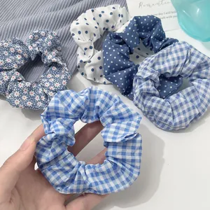 Blue and white pattern scrunchie set including floral, polka dot, and plaid styles